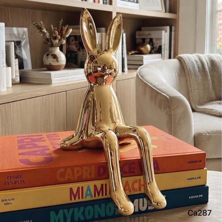 Articulo decorativo conejo dorado pequeño 8cm* 10cm* 21cm